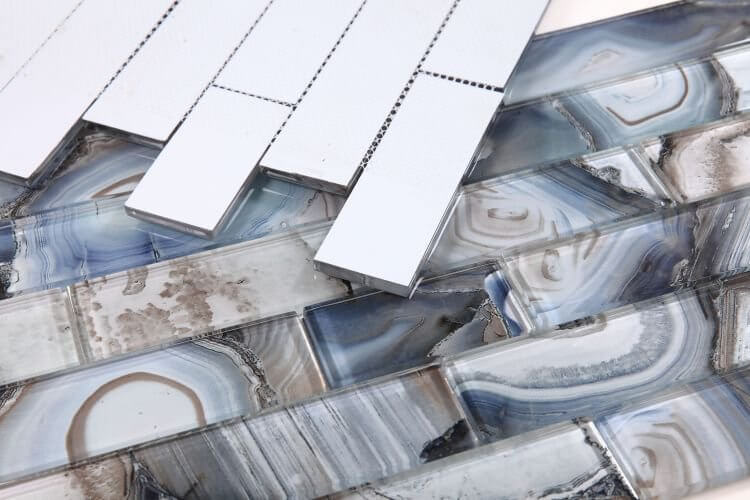 Artistic blue shell design glass tiles in large linear pattern, showcasing Casale Shell Blue 11.75x11.75 for indoor use.