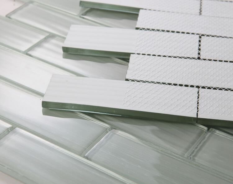 Casale Silver Grey 11.75x11.75 textured glass tiles in subway layout, showcasing glossy grey finish and design.