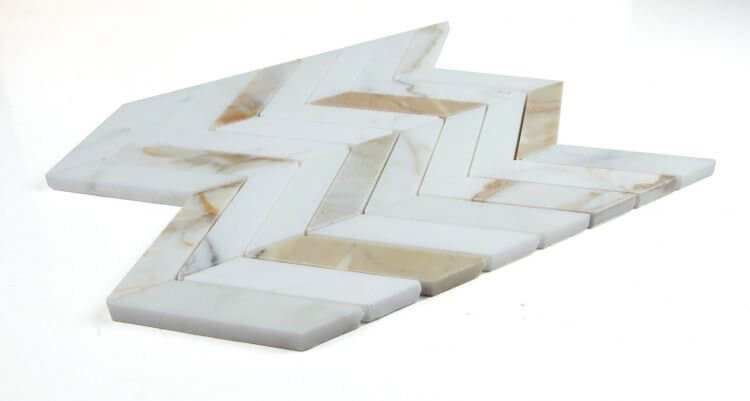 Chevron Calacatta Gold Honed marble mosaic tiles in a stylish chevron pattern, showcasing gold and grey veining.