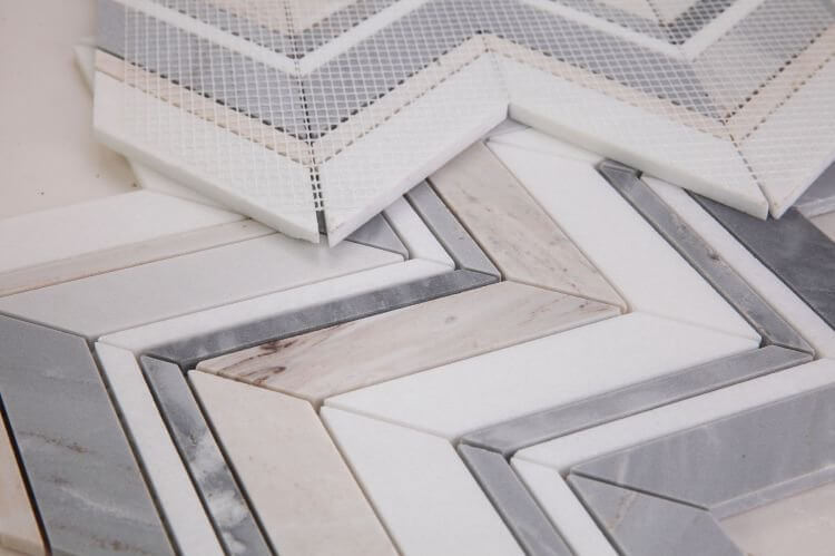 Chevron Ravenna Blue marble mosaic tiles, featuring elegant chevron pattern with white and blue marble accents.