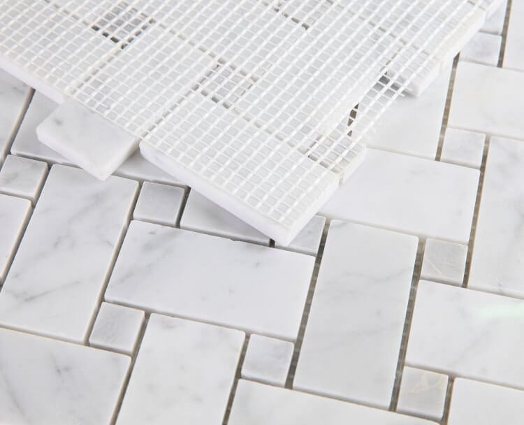 Calacatta Loft 12x12 marble mosaic tiles showcasing Italia Carrara and Bardiglio Grey in pinwheel pattern.