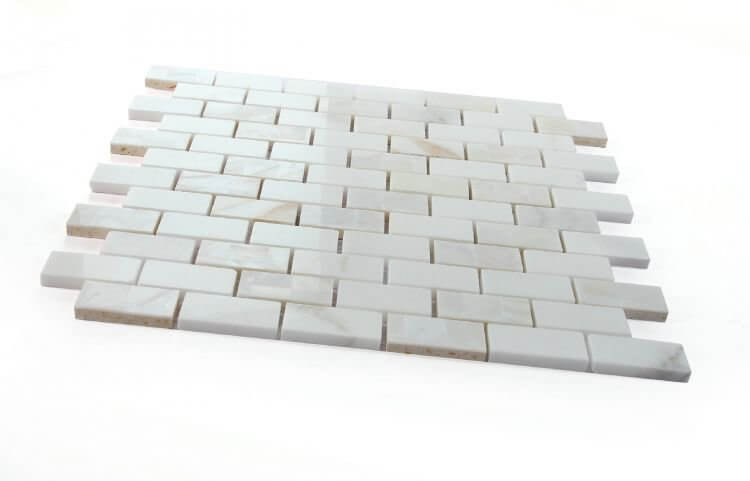 Diana Brick Calacatta mosaic tile in a brick pattern, featuring Mother of Pearl and Calacatta Gold marble.