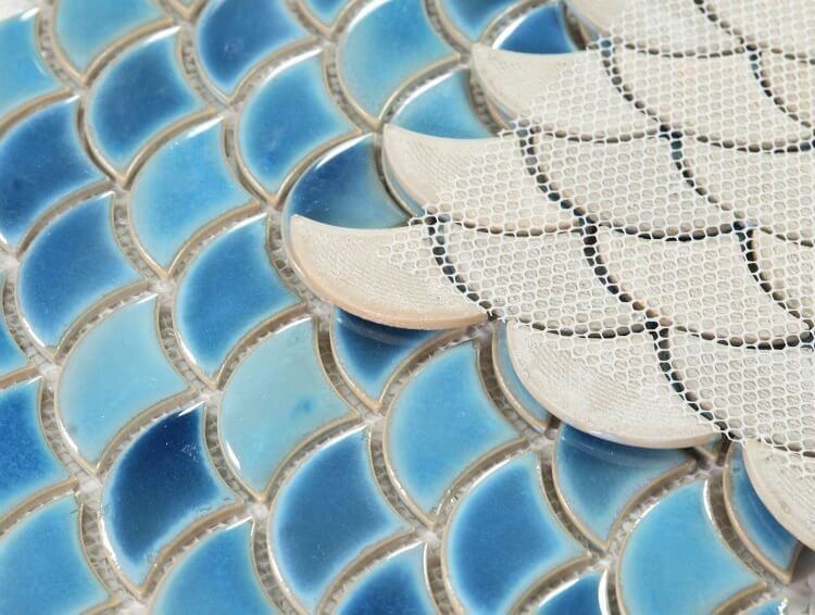 Close-up of Dragon Scale Navy porcelain mosaic tiles in blue shades, showcasing a unique scale pattern.