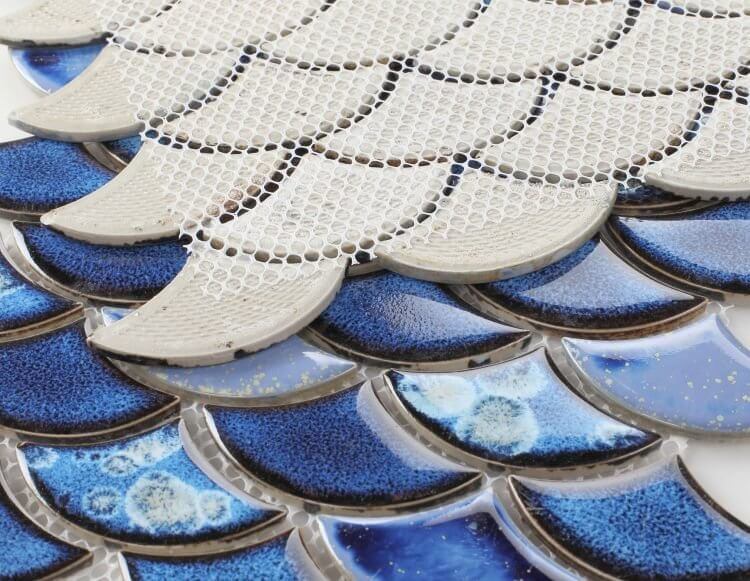 Close-up of Dragon Scale Royal Blue mosaic tile showcasing rich blue hues and unique textured design elements.