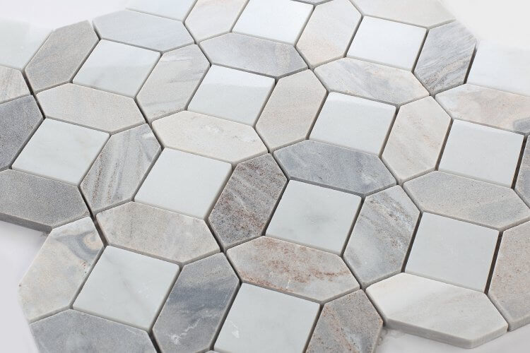 Carrara Blue Sky mosaic tile featuring soft blues, grays, and whites, showcasing elegant veining and tonal variations.