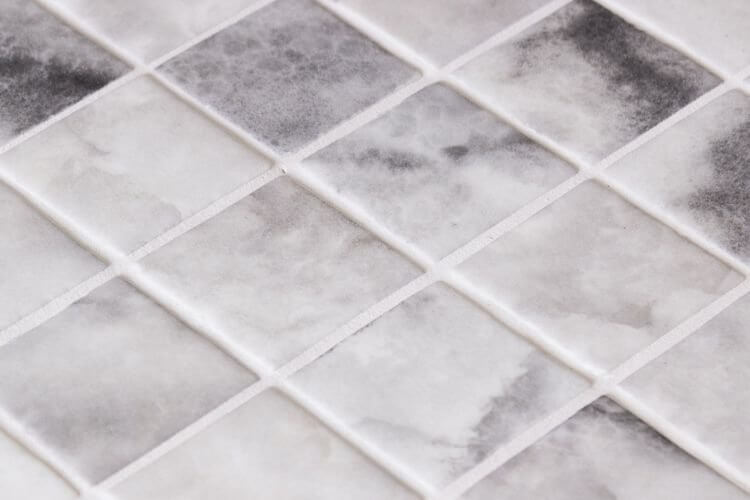 Ecostone Penta Onice Matte mosaic tiles showcasing 2x2" recycled glass in a contemporary pattern.