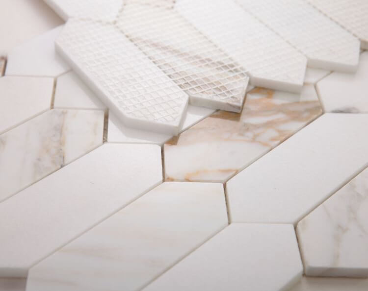 Elongated Hex Calacatta marble tiles 11.75x15, showcasing white and gold patterns in hexagonal shapes.