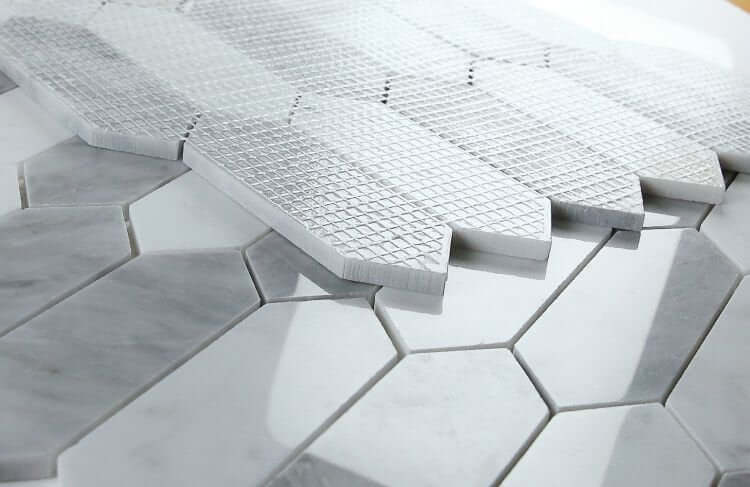 Elongated Hex Dusk marble mosaic tiles featuring Carrara and Bardiglio patterns in grey and white.