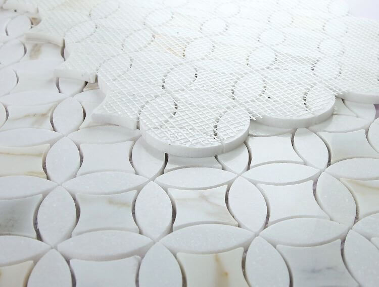 Embrace Calacatta Gold marble mosaic tiles in circular shapes, 11.75 x 11.75, featuring white and gold tones.