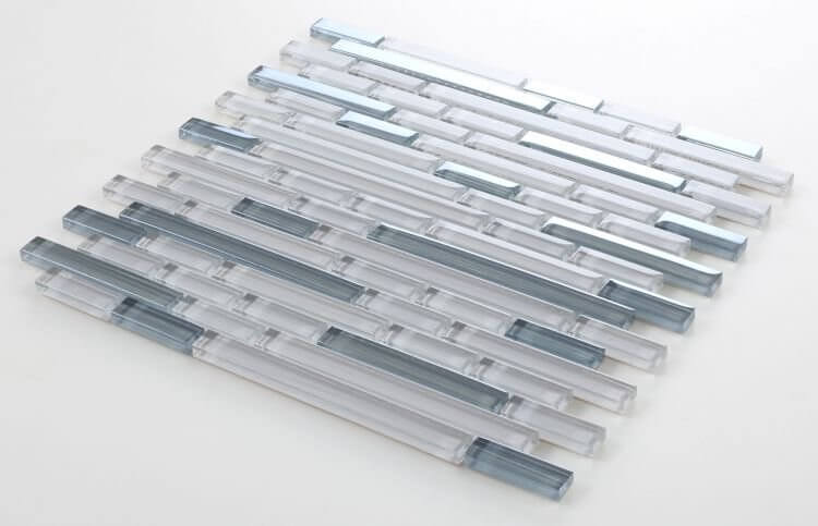 Light grey and grey bamboo glass mosaic tile in offset layout with iridescent effect and glossy finish.