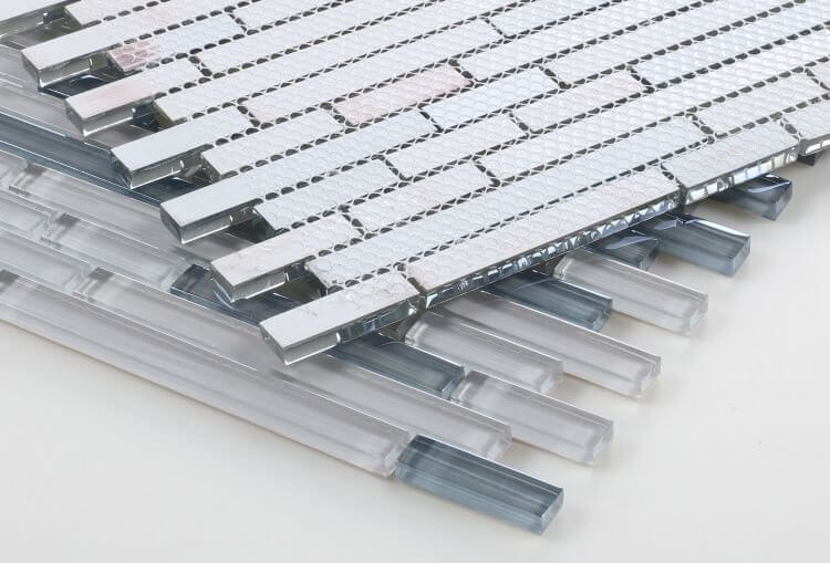Light grey glass tile mosaic with iridescent effect in linear offset layout, ideal for modern design.