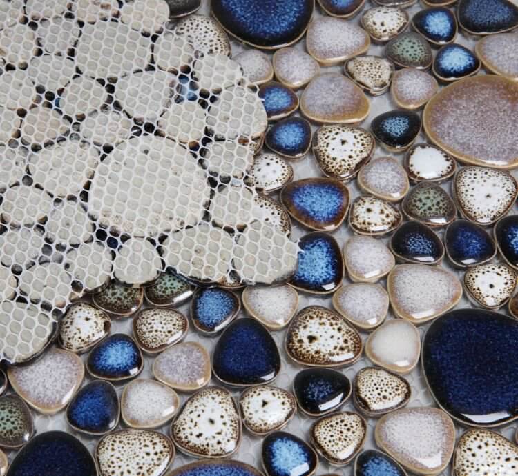 Poseidon Atlas 11.50x11.50 pebble mosaic tile with a mix of natural textures and colors, perfect for pool areas.