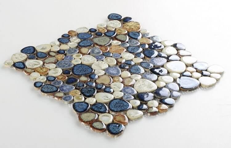 Poseidon Blue 11.50 x 11.50 pebble mosaic tile showcasing shades of blue, tan, and cream for pool areas.