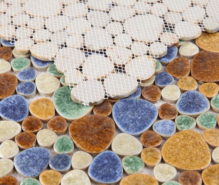 Close-up of Poseidon Forest 11.5 x 11.5 Pebble Mosaic Tile featuring earthy tones and natural pebbles.