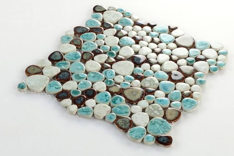 Poseidon Grass 11.5 x 11.5 Pebble Mosaic Tile in vibrant greens and neutral tones, perfect for poolside designs.