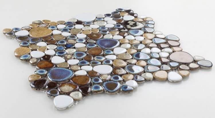 Poseidon Mango 11.50 x 11.50 pebble mosaic tile showcasing smooth, textured porcelain pebbles in earthy tones.