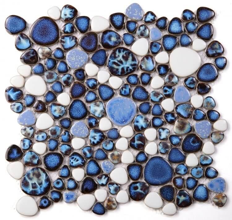 Poseidon Royal Blue Pebble Mosaic Tile featuring various shades of blue and white in a modern design, ideal for pool areas.