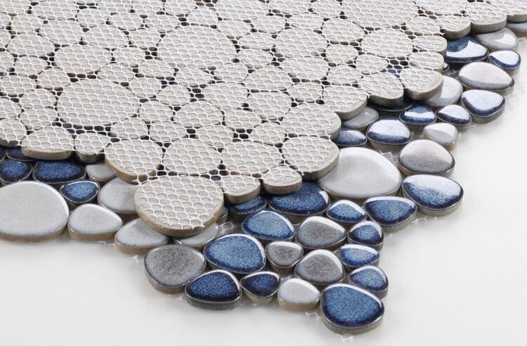 Poseidon Sky 11.5x11.5 pebble mosaic tile showcasing smooth gray and blue porcelain pebbles.